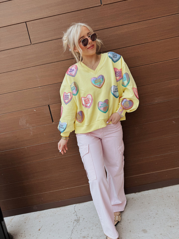 QOS Pale Yellow Positive Candy Hearts V-Neck Sweatshirt