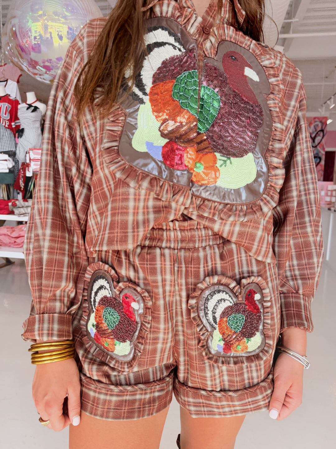 QOS Brown Plaid Turkey Ruffle Button Up Top